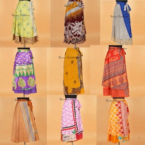 May include: A collection of nine wrap skirts displayed on mannequins, featuring various vibrant colors, intricate floral, paisley, and geometric patterns, with tie-waist closures and diverse fabric textures in a grid layout on a plain background.