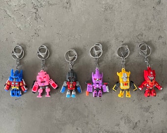 Transformatoren | 3D Schlüsselanhänger | Blau, Pink, Grau, Lila, Gelb & Rot