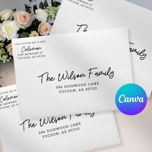 May include: White envelopes with black calligraphy text. The envelopes feature names and addresses, including "The Wilson Family" and "Coleman." A Canva logo is visible. Floral arrangement in the background.
