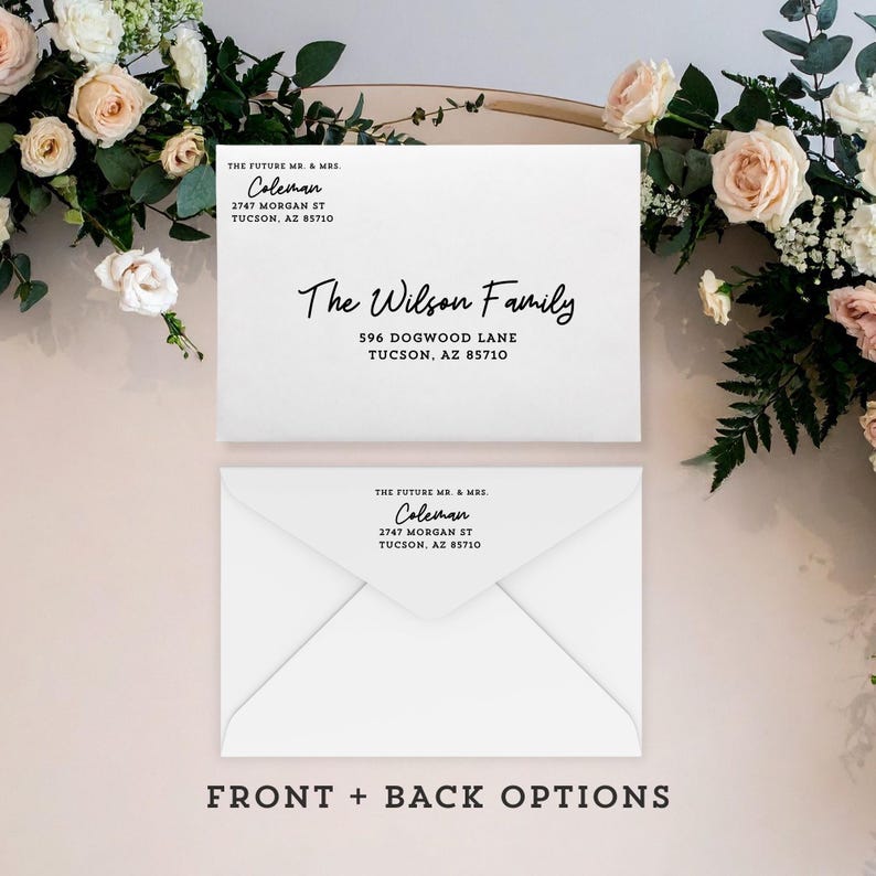May include: Two white envelopes with black text. The top envelope reads "The Wilson Family" and address. The bottom envelope has the return address. The text "FRONT + BACK OPTIONS" is at the bottom. Floral arrangement in the background.