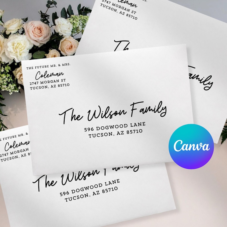 May include: White envelopes with black calligraphy text. The envelopes feature names and addresses, including "The Wilson Family" and "Coleman." A Canva logo is visible. Floral arrangement in the background.