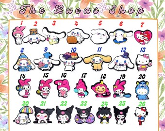 May include: A set of 26 colourful cartoon character charms featuring Hello Kitty, My Melody, and Kuromi. The charms are made of rubber and are perfect for adding a touch of whimsy to your shoes, bags, or other accessories.