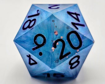 May include: A blue twenty-sided die with black numbers, 4, 9, 15, 18, 20, 17, 8, and 1. The die has a marbled appearance with a light blue and white swirl.