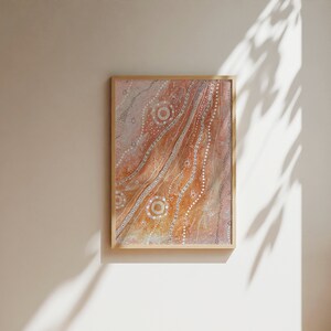 May include: A framed abstract painting with a brown and white pattern. The painting features a swirling design with white dots and circles on a brown background.