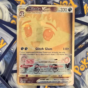 May include: A Pokemon trading card featuring Milady VSTAR, a pink and orange character with large eyes. The card has a gold background and features the text "VSTAR Milady" and "Glitch Glam". The card also has a VSTAR Power ability called "Dripstar Neochibi".