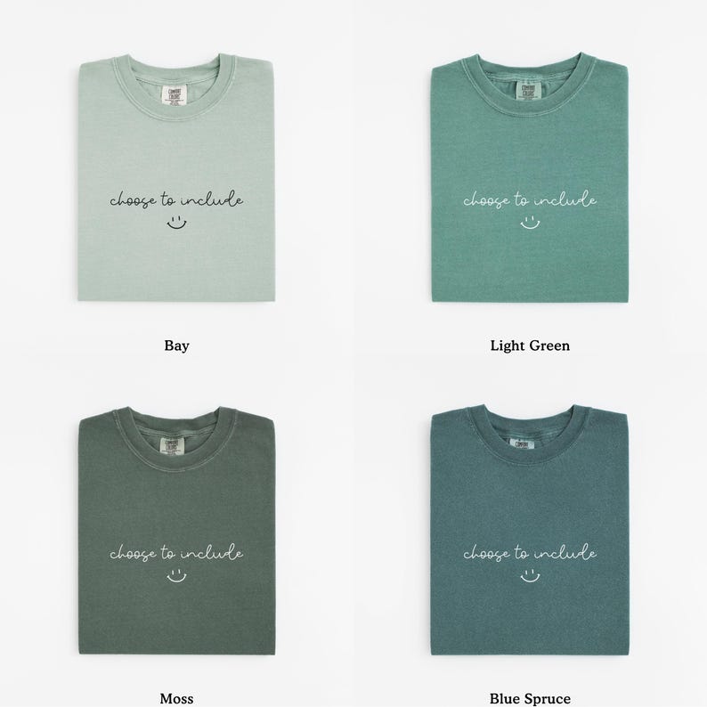 May include: Four folded t-shirts in different colors: bay, light green, moss, and blue spruce. Each shirt has the text "choose to include" and a smiling face printed on the front.