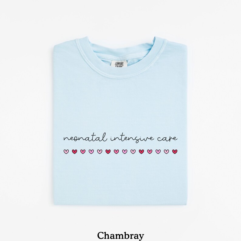 May include: Light blue t-shirt with the text "neonatal intensive care" and a row of pink and red hearts.