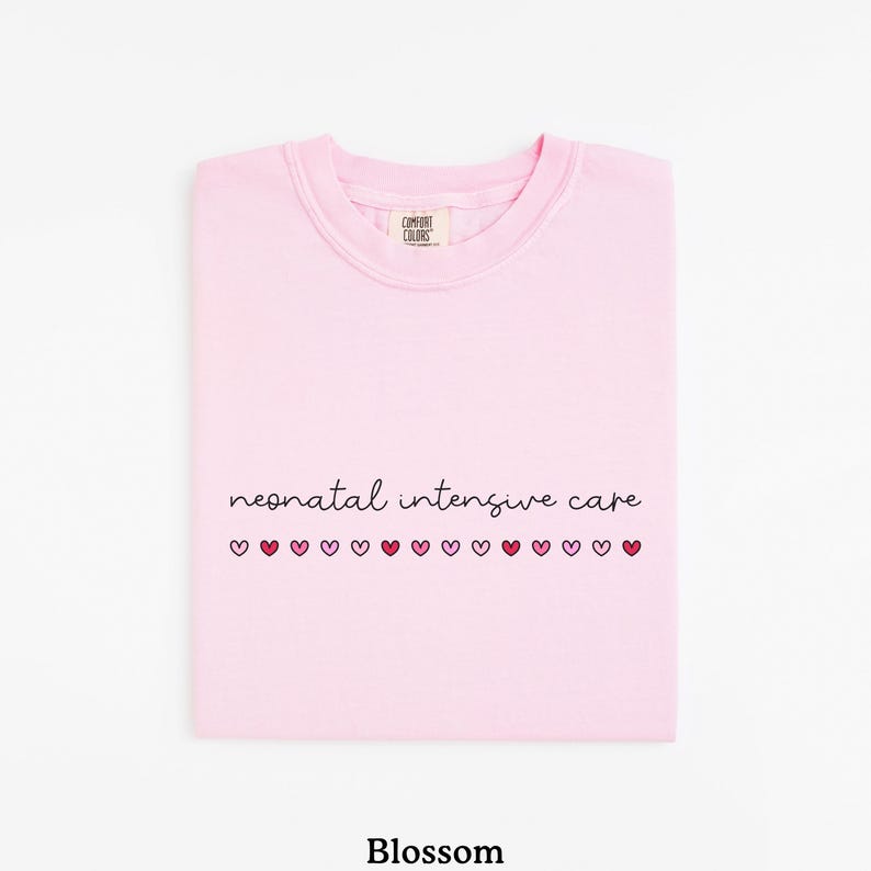 May include: Pink t-shirt with the text "neonatal intensive care" and a row of pink and red hearts.