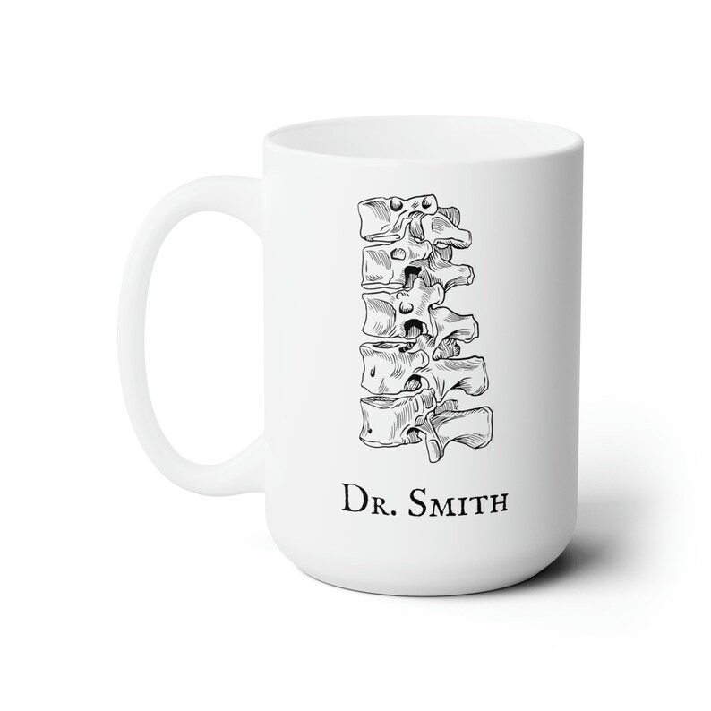 May include: White ceramic mug with a black line drawing of a human spine and the text "Dr. Smith" printed on the front.