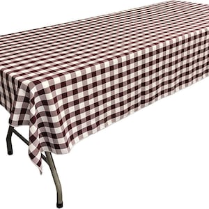 May include: A brown and white checkered tablecloth with a 108-inch length and 54-inch width.