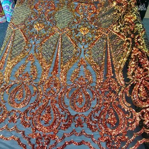 Princess Sequin Design on  4 Way Stretch Mesh Fabric-Prom-Sold By The Yard. Orange Black