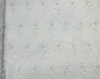 Royalty Fabrics Multi color Sun flower 3d design embroider in a Hunter green mesh lace-sold by the yard.