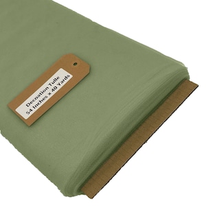 May include: A roll of sage green tulle fabric, 54 inches wide and 40 yards long. The fabric is folded and a brown tag with the text "Decoration Tulle 54 Inches x 40 Yards" is attached.