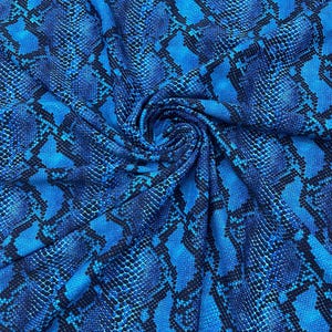 May include: Blue and black fabric with a snake skin pattern.