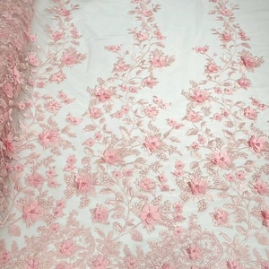 3D floral design embroider with pearls in a mesh lace-sold by the yard. Light Blue