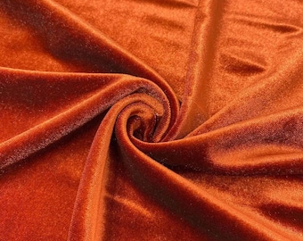 Tela de terciopelo elástico de 152 cm de ancho, 90 % poliéster y 10 % elastano, para coser prendas, disfraces y manualidades. Se vende cortada a medida. Color naranja quemado.