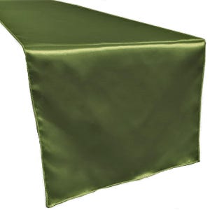 May include: A green satin table runner. The runner is a solid colour and has a smooth, silky texture.