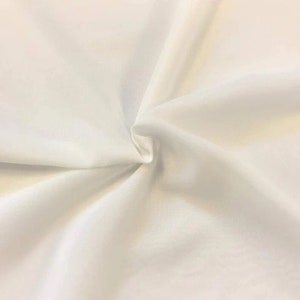 58/60" Wide 100% Polyester Soft Light Weight, Sheer, See Through Chiffon Fabric Sold By The Yard. Ivory