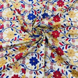 Oaxaca multi color Mexican Sarape floral design embroider on mesh lace-sold by the yard. Red/Yellow/Royal on Yellow