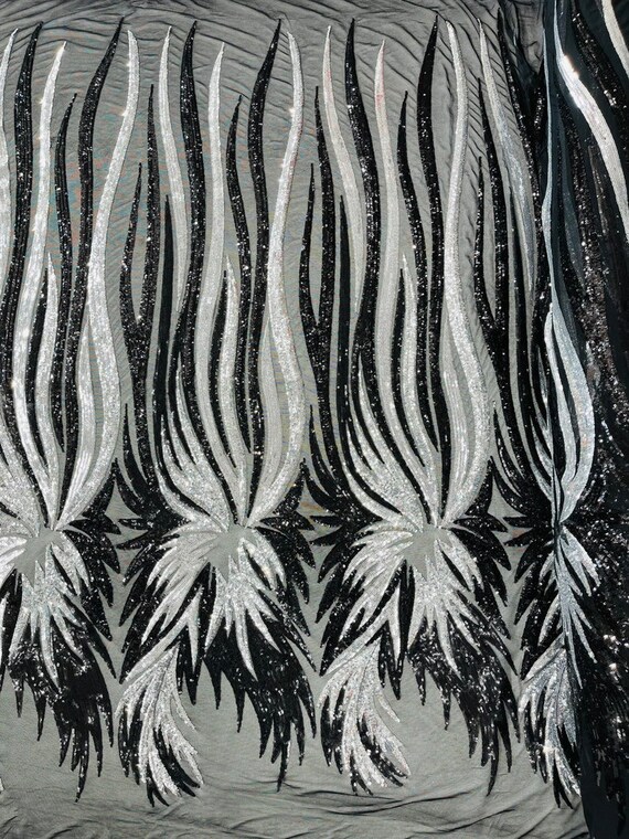 Silver/Black sequin Wings design on a Black 4 way stretch mesh fabric- prom-nightgown-by the yard-free shipping in the USA.