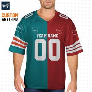 May include: A teal and maroon football jersey with white accents and the text "TEAM NAME" and "00". The jersey has short sleeves and the words "CUSTOM ANYTHING" are visible in the upper left corner.