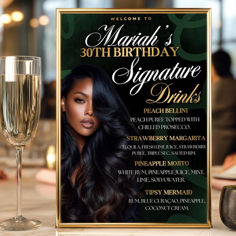 May include: A framed sign with gold trim lists "Mariah's 30th Birthday Signature Drinks." The sign features a woman with long black hair and drink recipes: Peach Bellini, Strawberry Margarita, Pineapple Mojito, and Tipsy Mermaid. A champagne glass is in the foreground.