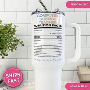 May include: A white stainless steel tumbler with a handle and a straw, featuring a nutrition facts label design for a computer science teacher. The text includes coding, debugging, logic, algorithms, innovation, and problem solving, with the name mrs.caroline printed in blue script at the bottom.