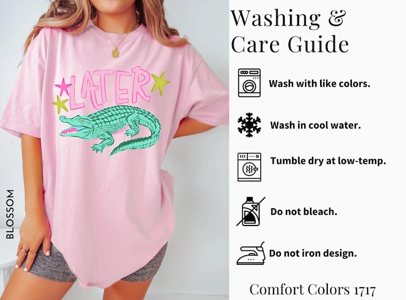 May include: Pink t-shirt with a green alligator graphic and the word "LATER" in pink. The shirt includes washing instructions and is made of Comfort Colors 1717 material.