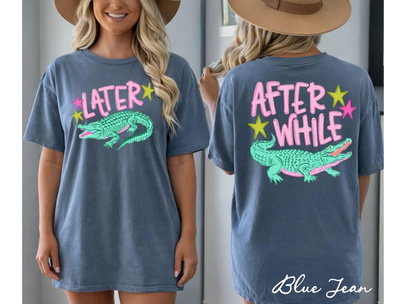 May include: Blue jean-colored t-shirt with a front and back design. The front says "LATER" in pink with a green alligator graphic. The back says "AFTER WHILE" in pink with a green alligator graphic. Pink and yellow stars are also included.