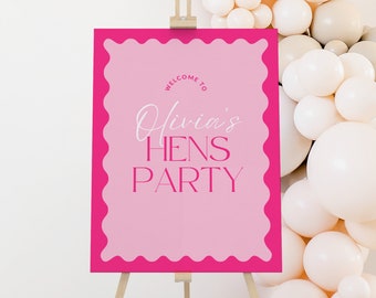 May include: Pink and white welcome sign with the text "Welcome to Olivia's Hens Party" on a pink background with a scalloped border.