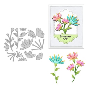 May include: A collection of floral die cuts and finished paper flowers. The finished flowers are pink and teal with yellow accents and green stems. One card features the text "Surrounded by Joy" on a green label.