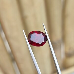 Lab Created Ruby Gemstone: Oval Faceted Red Healing Stone, 7.60 CTS