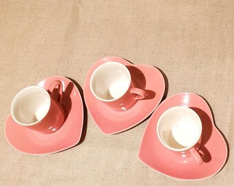 3 coffee cups with 3 vintage heart-shaped saucers in shabby chic earthenware