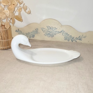 Original foie gras dish with a goose&#39;s head. French foie gras set. White earthenware foie gras dish