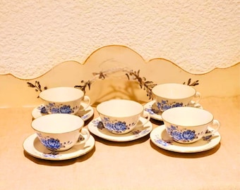 Vintage set of 5 matching tea cups and saucers . Flowery earthenware cup in blue and gray tones