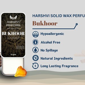 May include: A round, white solid wax perfume container with a black and gold label that says "HARSHVI PERFUMES" and "BUKHOOR SOLID PERFUME". The container is 10 grams and is surrounded by wood and amber.