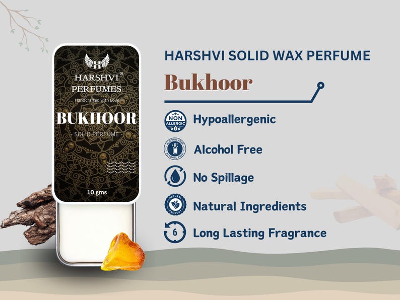 May include: A round, white solid wax perfume container with a black and gold label that says "HARSHVI PERFUMES" and "BUKHOOR SOLID PERFUME". The container is 10 grams and is surrounded by wood and amber.