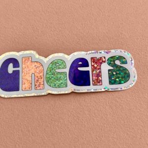 Pegatina "Cheers", p. ej. para tazas de café, termo, ordenador portátil, letras, purpurina, brillante, brillante, pegatinas, retro, brillo, glamour