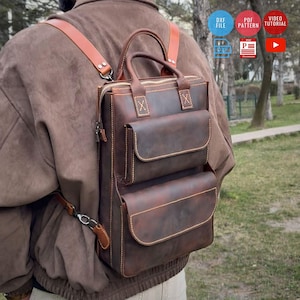 May include: A white ceramic mug with a black handle and the text "But First, Coffee" in a bold, black font. The mug is set against a blurred background, suggesting a cozy setting.