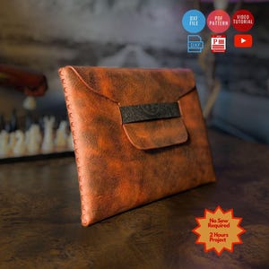 May include: A brown and black mottled envelope-style pouch with a textured surface and a central dark strap closure. The edges feature visible stitching. A star-shaped graphic includes the text No Sew Required and 2 Hours Project.