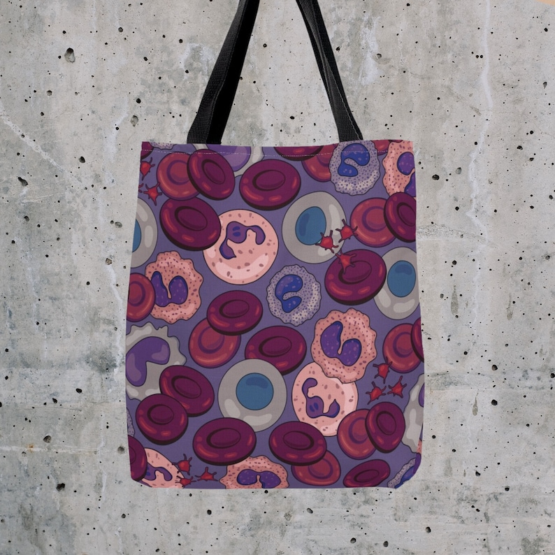 May include: A purple tote bag with a repeating pattern of red, white and blue blood cells. The bag has black handles.