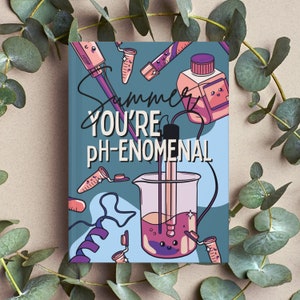 May include: A blue notebook with a colourful illustration of a beaker, test tubes, and the text "Summer You're PH-ENOMENAL".