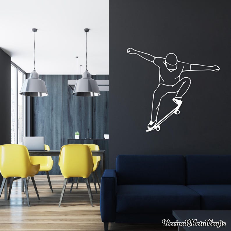 May include: White silhouette wall decal of a person skateboarding. The decal is on a dark gray wall in a room with a blue couch, yellow chairs, and a wooden table.