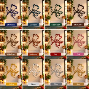 May include: A collection of twelve wall-mounted metal chef silhouettes in various colors including ultramarine, space blue, grass green, bitter coffee, milky brown, red copper, red, pink, yellow, white, silver, and gold, each holding a plate.
