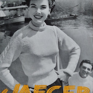 May include: Vintage black and white magazine cover featuring a woman wearing a light-colored turtleneck sweater. The word "JAEGER" is in orange, stylized text. The magazine also has the text "SIX PENCE No. 3318".