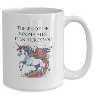 May include: White ceramic coffee mug with a colorful unicorn illustration and the text "There's other roommates then there's you".