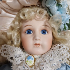 Bebe Jumeau by Maryse Nicole, 15" doll wearing exquisite dress with matching bonnet and floral cameo