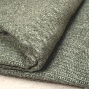 Cashmere and merino wool blanket herringbone vibrant olive and cream