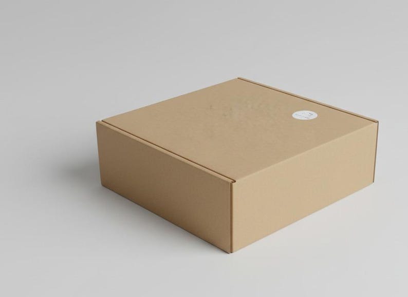 Gift box for a wool blanket, craft cardboard with a logo sticker.