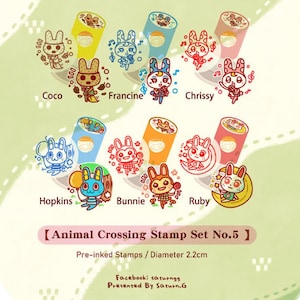 May include: Set of 10 pre-inked Animal Crossing character stamps. Each stamp is 2.2 inches in diameter and features a different character from the game. The stamps are arranged in two rows of five. The characters include Coco, Francine, Chrissy, Hopkins, Bunnie, Ruby, and others.